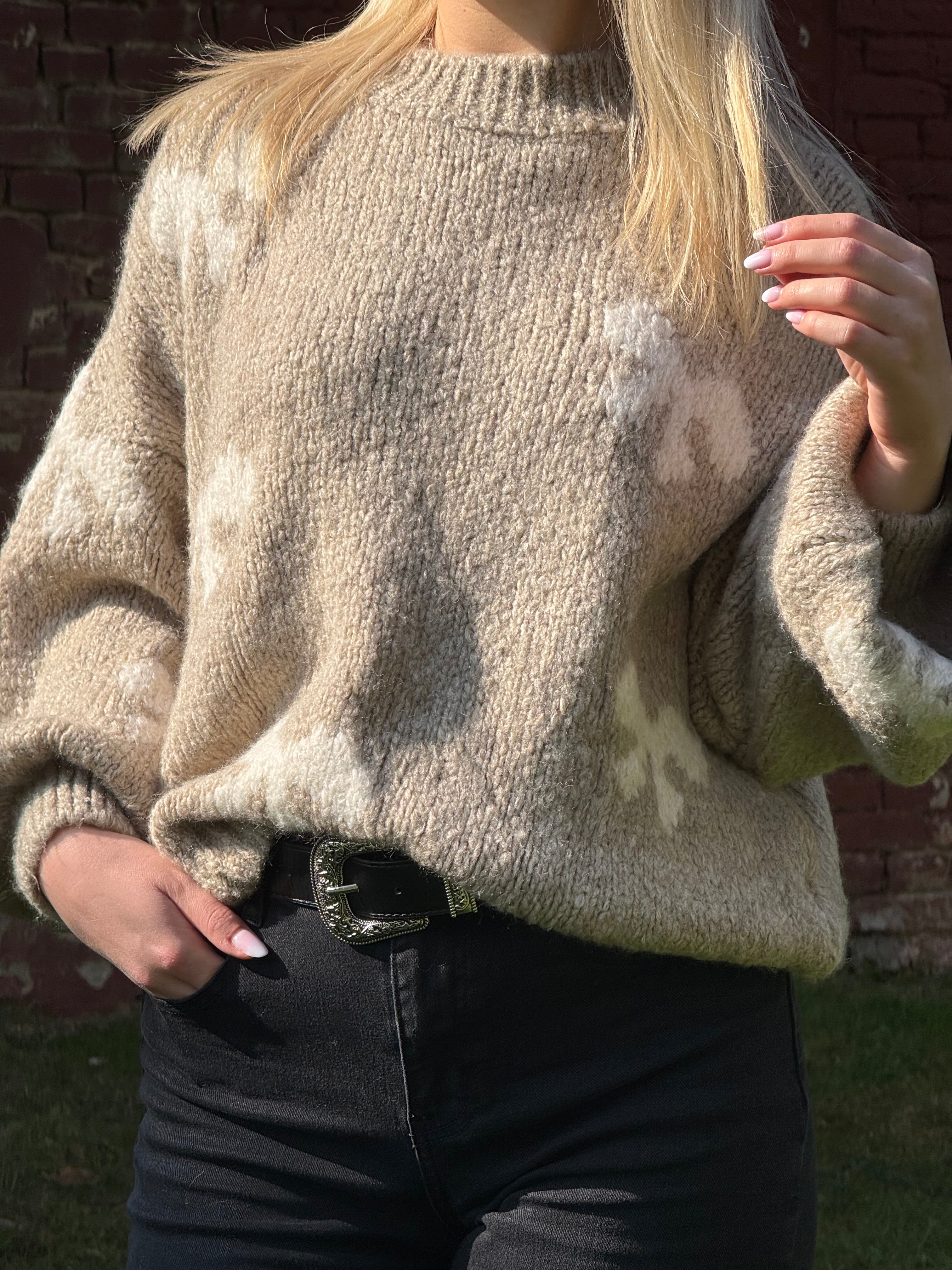 Pull beige avec noeud blanc